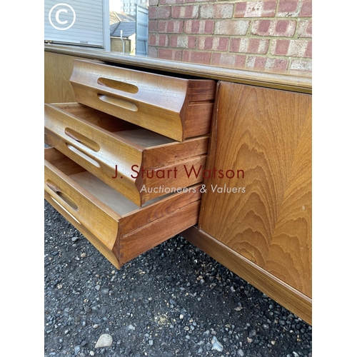 33 - A mid century teak sideboard by Elliots of Newbury  186x45x80