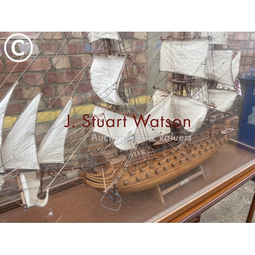 332 - A large glass cased model on stand of HMS Victory 120x40x165