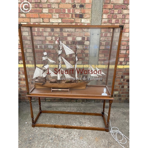 333 - A large glass cased model on stand of Cutty Sark130x48x168