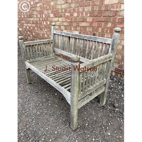 336 - A smaller country house style hardwood garden bench 115cm