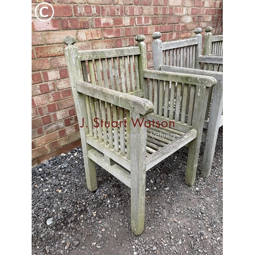 337 - Three hardwood carver garden chairs