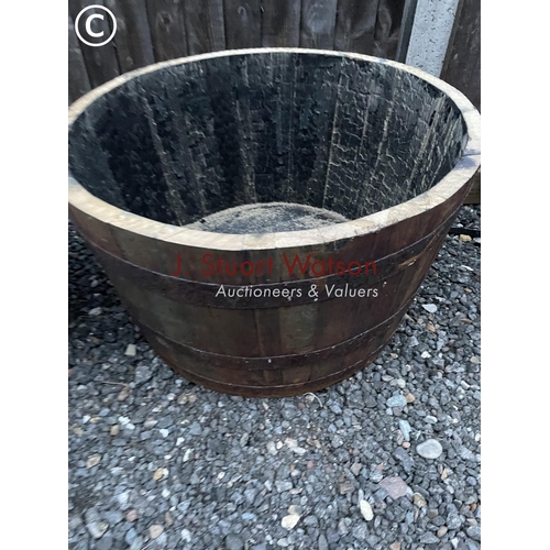 350 - A pair of Scottish oak half whisky barrel planters