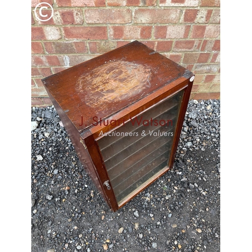 354 - A small mahogany collectors cabinet with glazed door 40x31x62