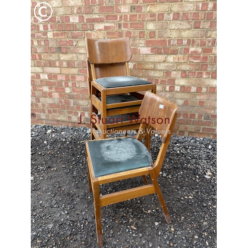 357 - A set of four mid century stacking chairs