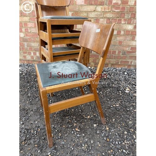 357 - A set of four mid century stacking chairs