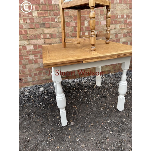 368 - A painted oak drawer leaf table together with one chair