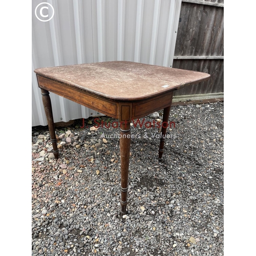 384 - A Victorian mahogany fold over card table