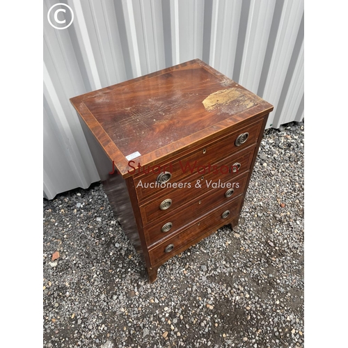 385 - An inlaid mahogany chest of four drawers