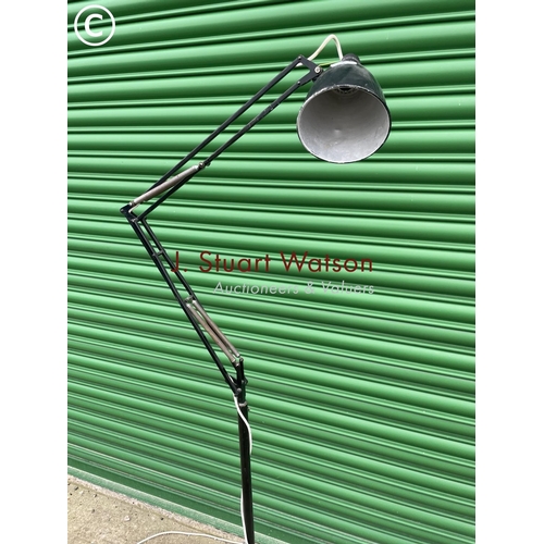 392 - A vintage black floor standing trolley anglepoise work lamp