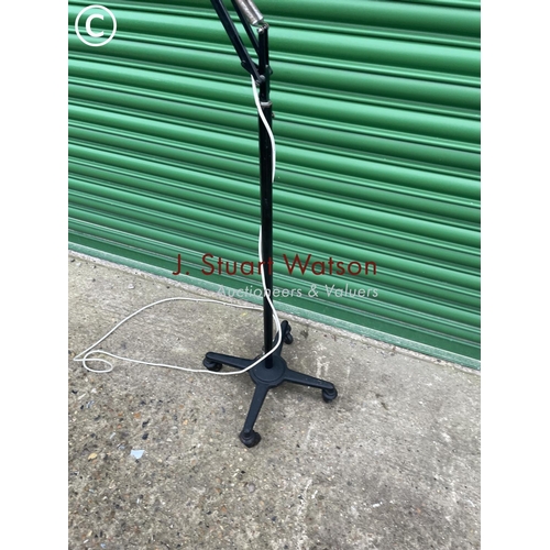 392 - A vintage black floor standing trolley anglepoise work lamp