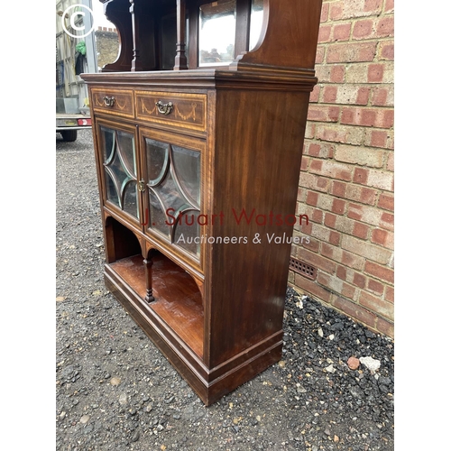 4 - An Edwardian mahogany inlaid cheffioner cabinet with a mirror back