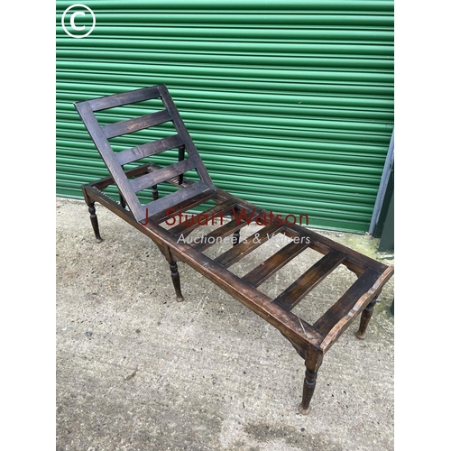 403 - An early 20th century oak treatment bed with adjustable position head