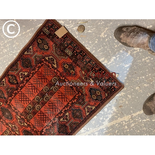 418 - A red / brown pattern runner rug