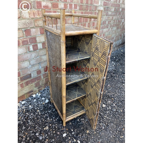 43 - A small antique bamboo cupboard with internal shelves