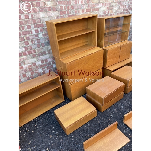 44 - A collection of 15 pieces of tapley teak home wall unit kit includes two bureaus, five floating draw... 