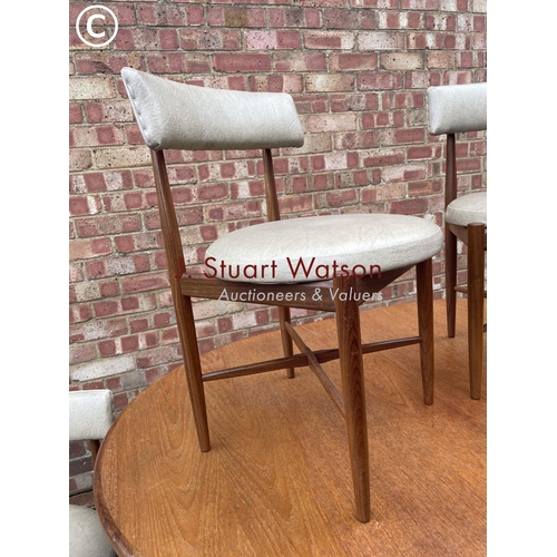 5 - A g plan mid century extending teak dining table together with a set of six g plan chairs with cross... 