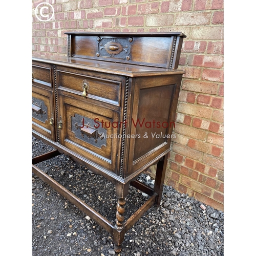 51 - An early 20th century oak barley twist sideboard 106 wide