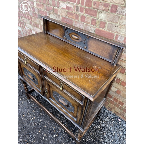 51 - An early 20th century oak barley twist sideboard 106 wide