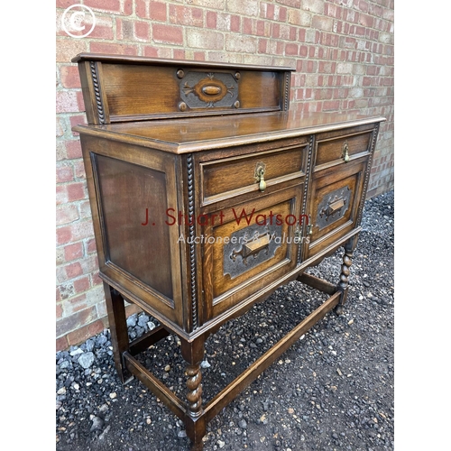 51 - An early 20th century oak barley twist sideboard 106 wide