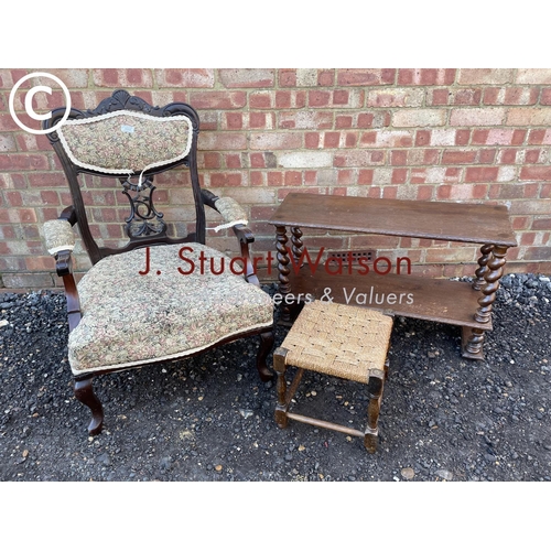 52 - An Edwardian salon chair, together with a barley twist bookcase and a stool