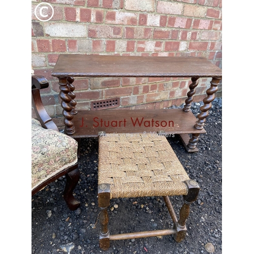 52 - An Edwardian salon chair, together with a barley twist bookcase and a stool