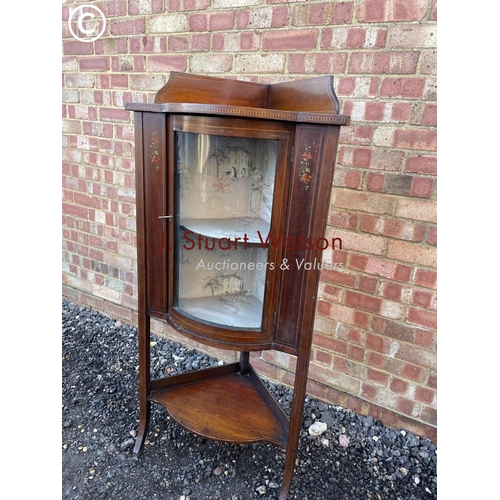 53 - An Edwardian inlaid corner cabinet