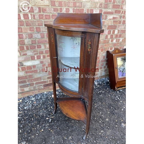 53 - An Edwardian inlaid corner cabinet