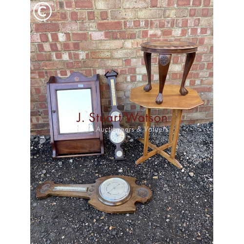 55 - An Edwardian bathroom cabinet together with two barometers, a light oak table and a carved stool