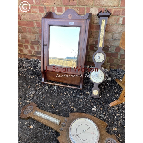 55 - An Edwardian bathroom cabinet together with two barometers, a light oak table and a carved stool