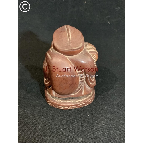 555 - Oriental carved hardwood figure of a man netsuke, height 8cms