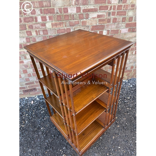 57 - An Edwardian revolving bookcase  120cm high