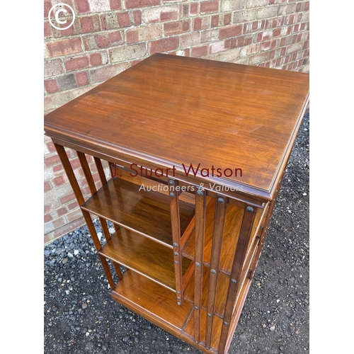 57 - An Edwardian revolving bookcase  120cm high