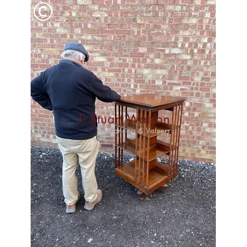 57 - An Edwardian revolving bookcase  120cm high