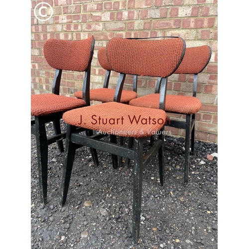 6 - A set of four retro butterfly back chairs