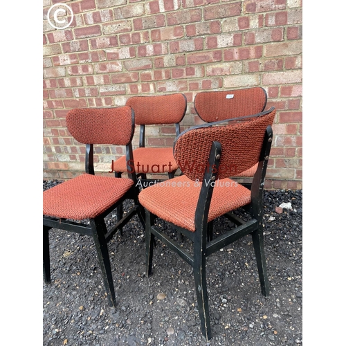 6 - A set of four retro butterfly back chairs