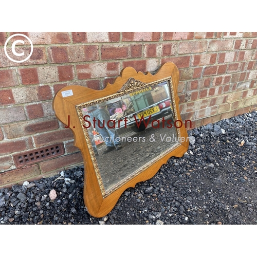 60 - A mahogany and gilt framed mirror