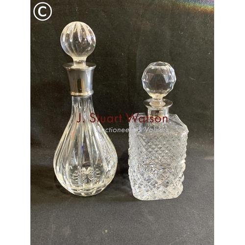 620 - 2 cut glass decanters with Hallmarked collars