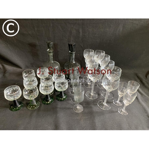 628 - Two smoke glass decanters and drinking glasses