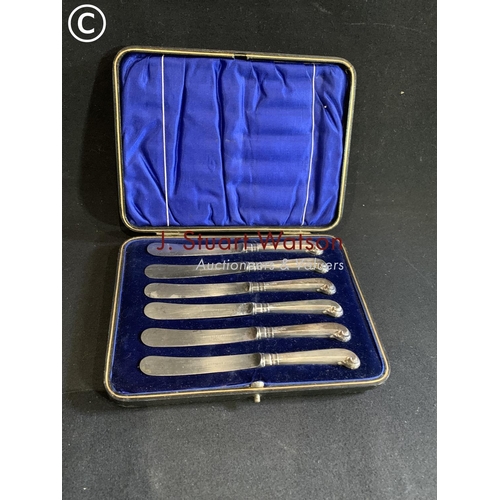 634 - Cased Silver handled pistol handled butter knives