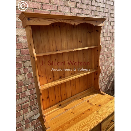 64 - A pine Welsh style dresser with plate rack back over two drawers and cupboard base