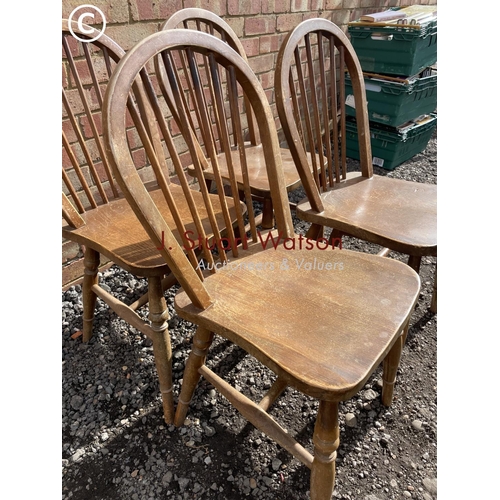 65 - A set of four Ercol style stick back kitchen chairs