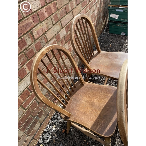 65 - A set of four Ercol style stick back kitchen chairs