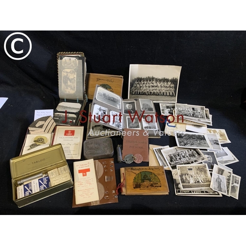 664 - Wartime photos, soldiers service and pay book, badges, ration tin, first aid kit.