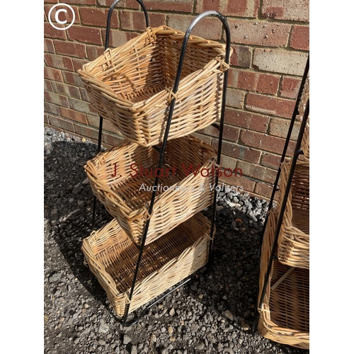 68 - A pair of wicker basket veg racks and a chest of three drawers