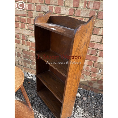 71 - An oak bookcase together with a oak bedside and a two tier occasional table