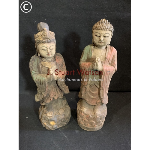 726 - Two painted carved wooden oriental figures height 31 cms