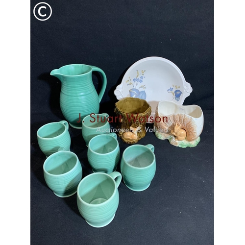 752 - Sylvac Cider Jug and six mugs, two planters and plate