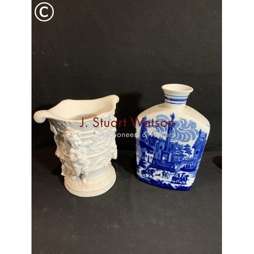 753 - Blue and white bottle vase height 32 cms and large Cherub decorated composition vase height 25 cms