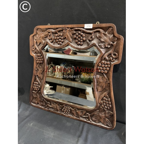 759 - Decorative oak mirror carved with vine leaves and grapes 59  x 56 cms