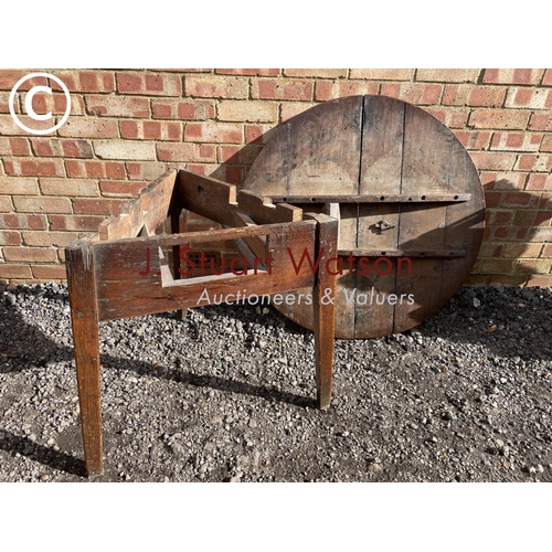 77 - An antique oak three legged cricket table